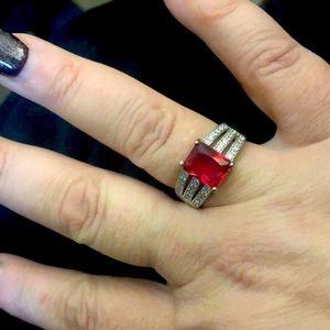 Sterling Silver and lab created Ruby ring with Cubic Zirconia accents. Size 9.5